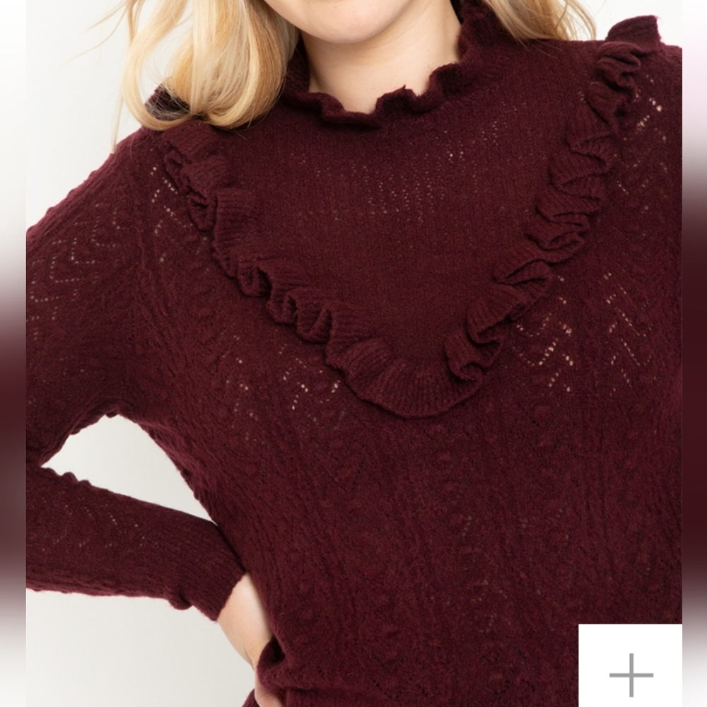 Eloquii open stitch sweater.